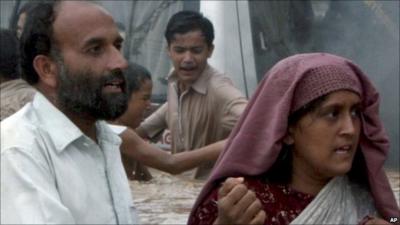 People wading through water