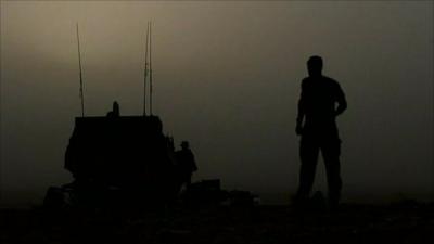 Soldier walking towards tank