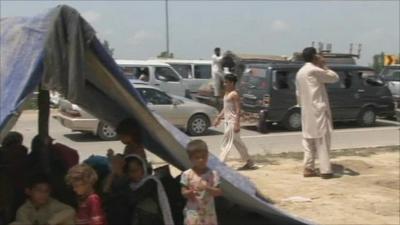 Refugees on the road out of the flood-hit region