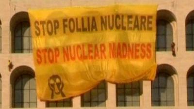 A Greenpeace banner saying "Stop nuclear madness"