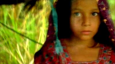 Girl awaits rescue in the rain