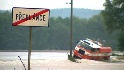 Vehicle trapped in floodwater