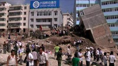 Building toppled by mudslide