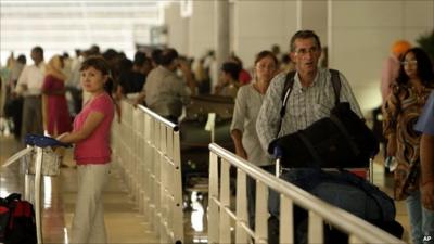 Travellers passing through airport