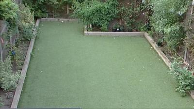 A garden with a fake grass lawn