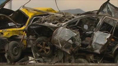 Wreckage of cars caught in roadside bomb