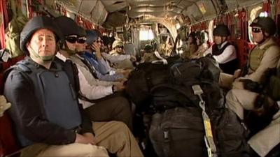 Liam Fox in a military helicopter