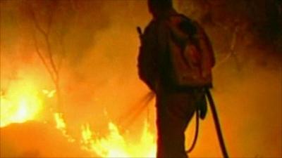 Fire fighter tackles Brazil wildfire