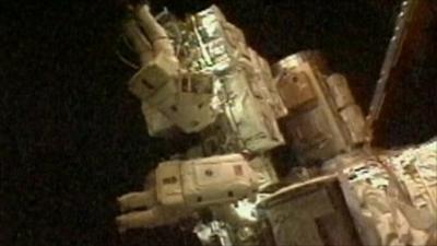 Astronauts on spacewalk at ISS