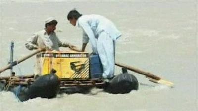 Flood victims on a makeshift raft