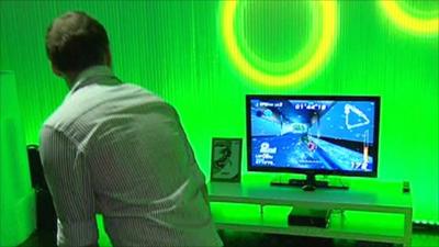 Man playing game using Kinect motion controller for the Xbox 360 at Gamescom, Cologne