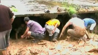 People search through rubble