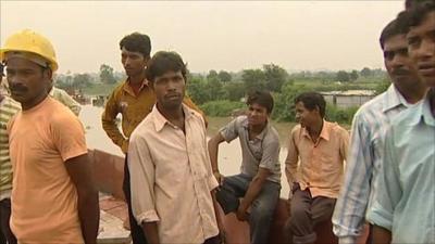 Construction workers in India hampered by flooding