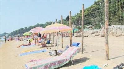 A fence divides the public and private beach in Gaeta