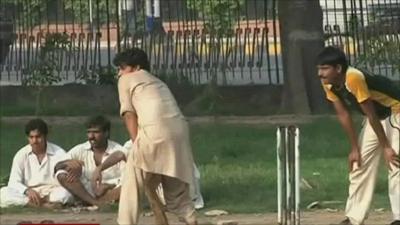 Men playing cricket in Islamabad park