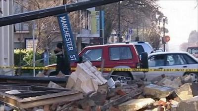 Rubble and toppled street sign in Christchurch