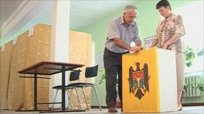 Electoral officials preparing a ballot box