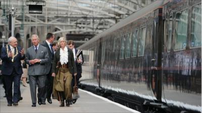 Prince Charles, Prince of Wales boards the royal train at Glasgow Central station