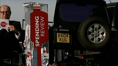 Nick Robinson sat in chair at car boot sale