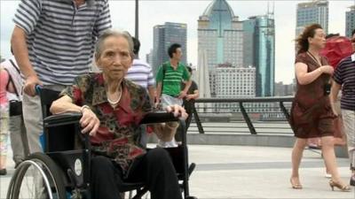 Elderly woman in wheelchair, Shanghai