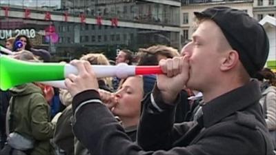 Man blowing horn