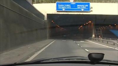 Looking out of the windscreen of a car on road