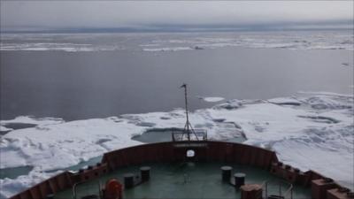 Prow of boat in water and ice