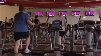 People in gym watching Ed Miliband speech