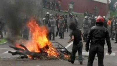 Man throwing missile at police