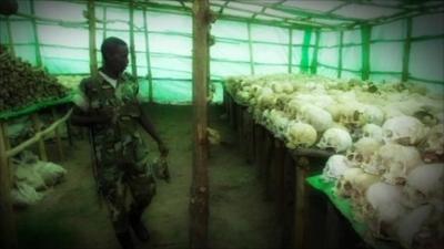 Soldier looking at skulls