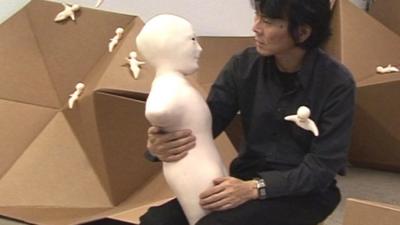 Hiroshi Ishiguro with the Telenoid R1