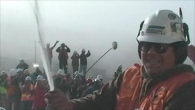 Celebrations as a drill reaches the chamber where miners are