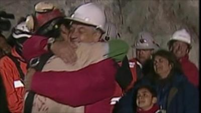 Chilean President Pinera hugs rescued miner