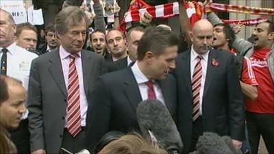 Martin Broughton and Christian Purslow outside court