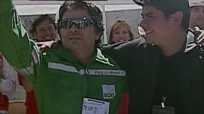 Miner Pablo Rojas (left) rejoices after coming to the surface