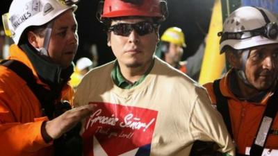Pedro Cortez (centre) with rescue workers