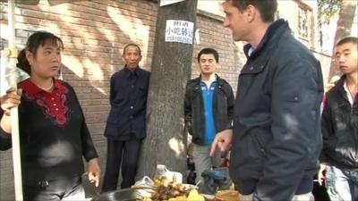 Liu Qingye selling food from her stall