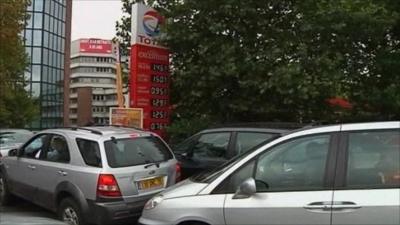 Cars queue for petrol