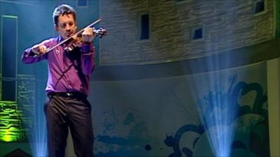 Oliver Lewis plays violin on Blue Peter