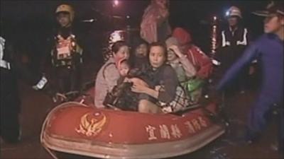 People being rescued in boat