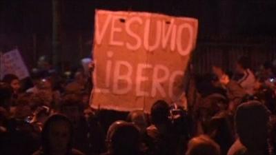 Protesters holding a sign