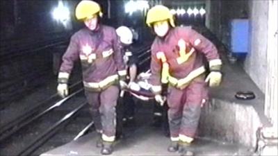 Firefighters carrying stretcher during 7/7 bombings