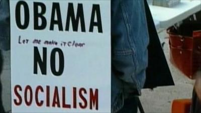 Republican supporter holding anti-Obama placard