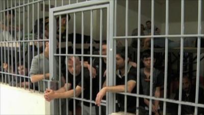 Migrants arrested in Greece crammed into jail cell