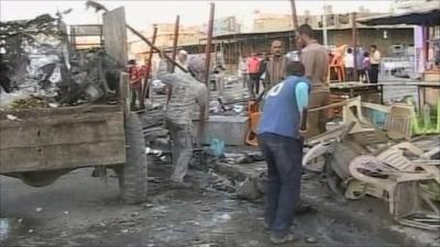 Men loading debris into truck