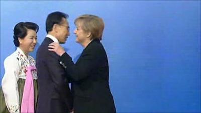 Angela Merkel embraces her counterpart