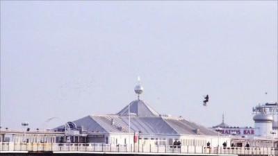 Kite surfer jumping Brighton Pier