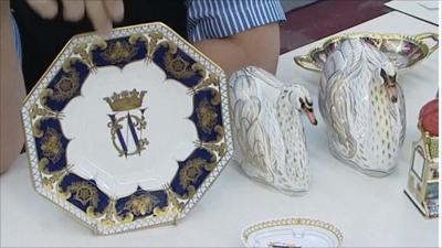 Plate showing intertwined initials and ceramic swans, designed to commemorate Royal engagement