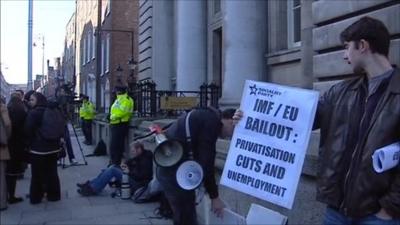 A man protests the bail-out proposals