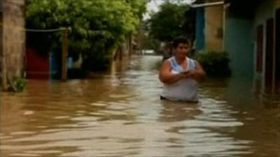 Person wades through water in Colombia